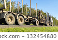 Timber truck with empty trailers and mobile crane on the highway. Timber export and shipping concept 132454880
