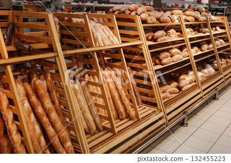 Bakery with a variety of breads on display. 132455223