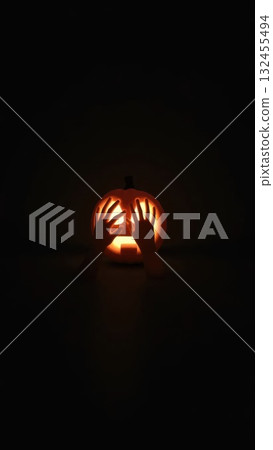 Minimalist Ghost Hands with Pumpkin Casting a Large Menacing Shadow 132455494