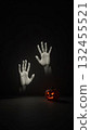 Minimalist Ghost Hands with Pumpkin Casting a Large Menacing Shadow 132455521