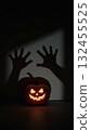 Minimalist Ghost Hands with Pumpkin Casting a Large Menacing Shadow 132455525