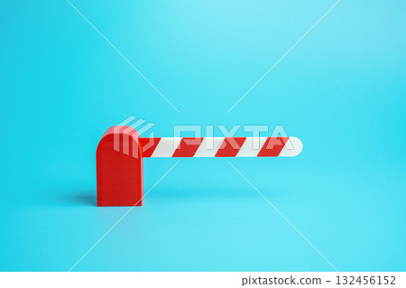 Closed traffic barrier. Entry ban. No access. Sanctions and restrictions. Economic embargo. International trade, migration policy, or business compliance. 132456152