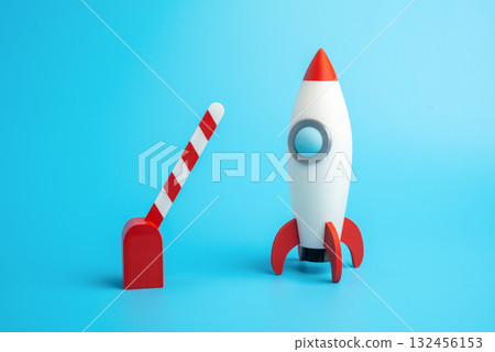 Rocket startup and open traffic barrier. Business launch permit. Investment or project financing. New beginnings, freedom to act, and investment approval. Startup innovation funding, entrepreneurship 132456153