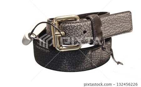 New fashion belt with gold buckle and security tag displaying modern style New fashion belt with gold buckle and security tag displaying modern style 132456226