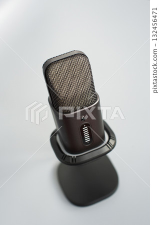 Close-up of modern black studio microphone on stand Close-up of modern black studio microphone on stand 132456471