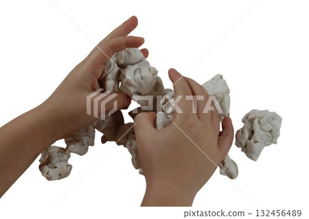 Child hands modeling white clay on white background 132456489