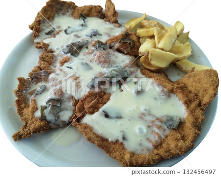 Breaded schnitzel cutlet with truffle cream sauce and fries 132456497