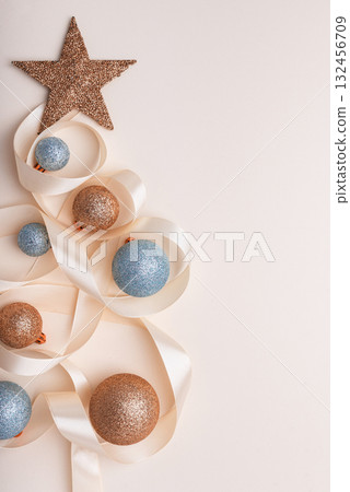 Minimalist Christmas Tree Made of Ribbon and Ornaments on Light Background 132456709