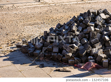 Cobble stone pile on street Cobble stone pile on street 132457106