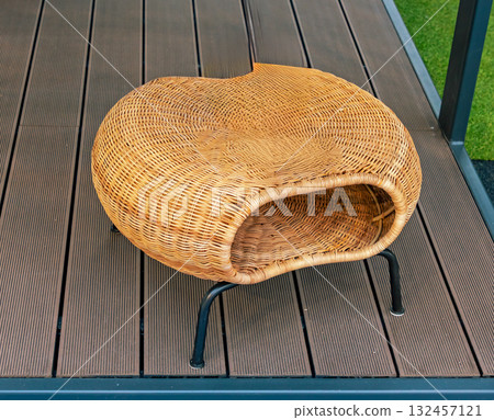 Small rattan stool on floor 132457121