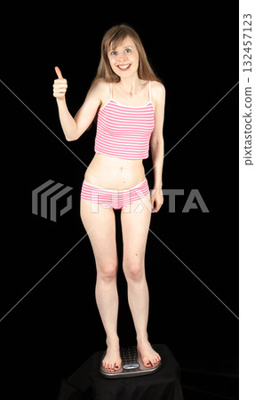 Woman on scale Woman on scale 132457123