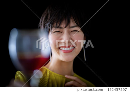 A lovely woman who looks good with wine to toast 132457297