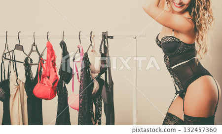 Sexy woman buying lingerie Sexy woman buying lingerie 132457360