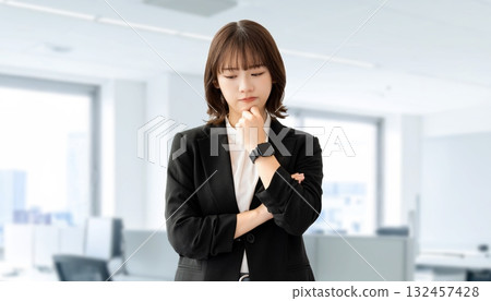 A young woman/businesswoman thinking 132457428