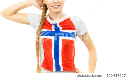Young woman holding norwegian flag 132457627