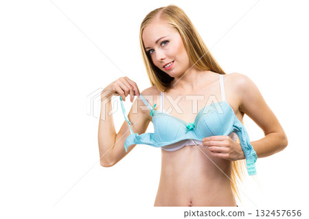 Woman choosing underwired bra Woman choosing underwired bra 132457656