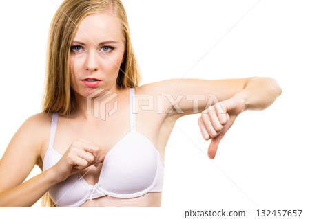 Woman dissatisfied with size of bra breasts Woman dissatisfied with size of bra breasts 132457657