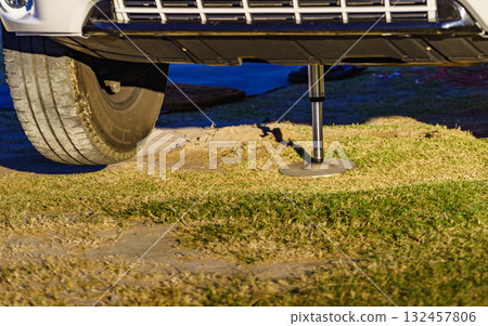 Camper leveling support leg in use. 132457806