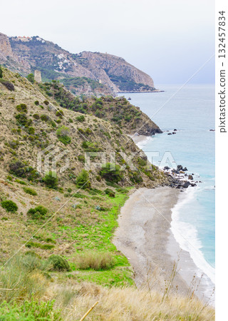 Tower on rocky coast, seaside cliffs, Spain 132457834