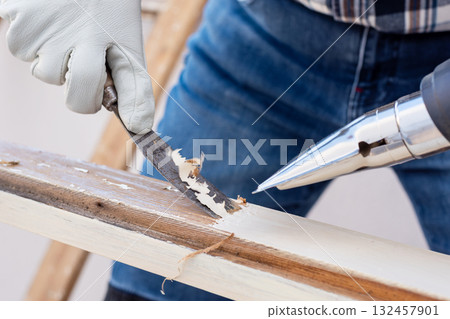 Carpenter at work, restoring an old wooden window. Carpentry. Carpenter at work, restoring an old wooden window. Carpentry. 132457901