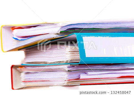 Many file folders, ring binders on office table Many file folders, ring binders on office table 132458047