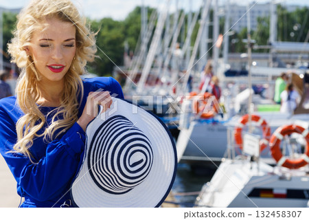 Fashion model wearing blue jumpsuit 132458307