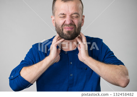 Man having throat, neck pain Man having throat, neck pain 132458482
