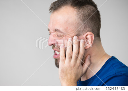 Man having tooth pain Man having tooth pain 132458483