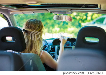 Woman driving car Woman driving car 132458641