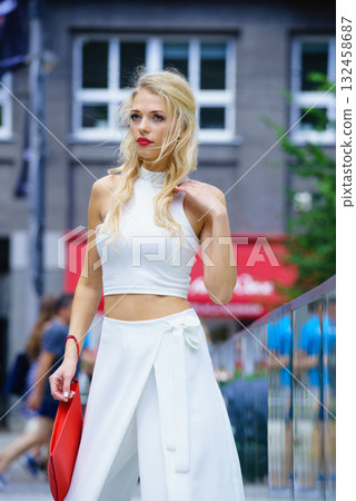 Woman wearing crop top and culottes Woman wearing crop top and culottes 132458687