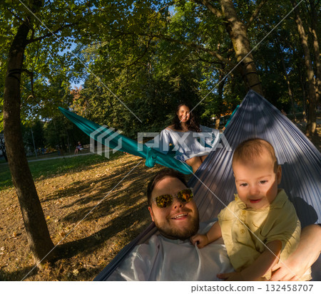 Family Relaxing in Park Hammocks 132458707