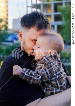 Father and Baby Smiling Outdoors Father and Baby Smiling Outdoors 132458711