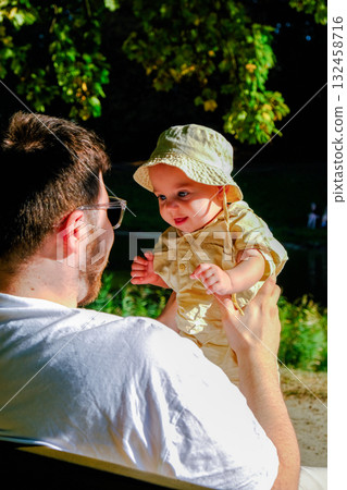 Father and Baby Enjoying a Sunny Day in the Park 132458716