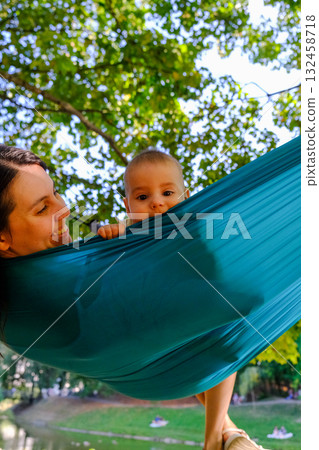 Child Peeking Over Hammock in Park 132458718