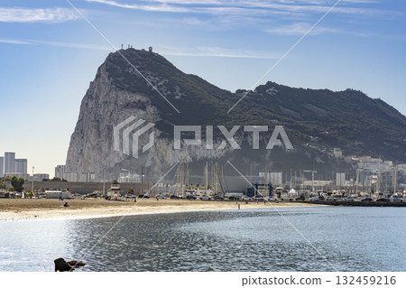 Sunny beach Scene With Gibraltar Across the Bay 132459216