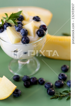 Nutritious protein snack yogurt with blueberries and melon cubes Nutritious protein snack yogurt with blueberries and melon cubes 132459937