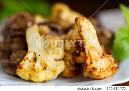 Healthy vegetarian meal with roasted cauliflower and mushrooms 132459972