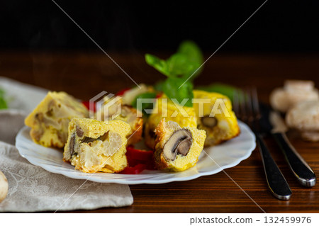 Homemade omelet with mushrooms and cauliflower on white plate Homemade omelet with mushrooms and cauliflower on white plate 132459976