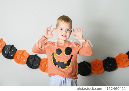 Cute Kids Celebrating Halloween with Pumpkin Buckets and Festive Emotions Cute Kids Celebrating Halloween with Pumpkin Buckets and Festive Emotions 132460411