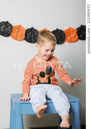 Cute Kids Celebrating Halloween with Pumpkin Buckets and Festive Emotions 132460415