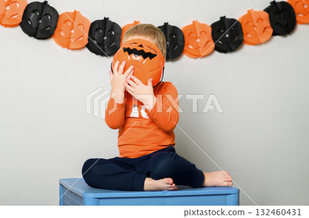 Cute Kids Celebrating Halloween with Pumpkin Buckets and Festive Emotions Cute Kids Celebrating Halloween with Pumpkin Buckets and Festive Emotions 132460431