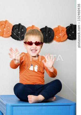Cute Kids Celebrating Halloween with Pumpkin Buckets and Festive Emotions Cute Kids Celebrating Halloween with Pumpkin Buckets and Festive Emotions 132460436
