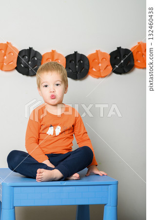 Cute Kids Celebrating Halloween with Pumpkin Buckets and Festive Emotions 132460438