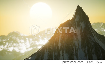 A stunning mountain peak towers against a vibrant sunset, casting shadows across the rugged landscape. The warm sunlight enhances the snow capped summit, creating a breathtaking view. A stunning mountain peak towers against a vibrant sunset, casting shadows across the rugged landscape. The warm sunlight enhances the snow capped summit, creating a breathtaking view. 132460537