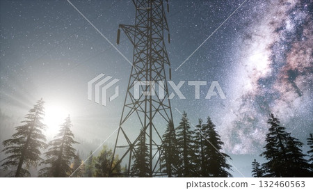 Beneath a stunning starry sky, towering power lines stand tall amidst a dense forest. The bright moonlight casts an ethereal glow, creating a magical landscape filled with natures beauty. Beneath a stunning starry sky, towering power lines stand tall amidst a dense forest. The bright moonlight casts an ethereal glow, creating a magical landscape filled with natures beauty. 132460563