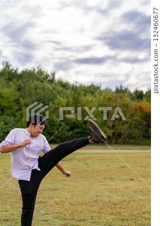 Man stretching with leg raised | Dynamic warm-up Man stretching with leg raised | Dynamic warm-up 132460677