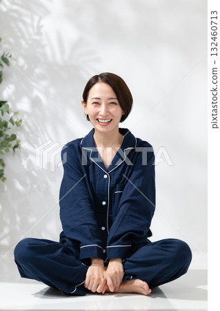Woman sitting in pajamas 132460713