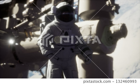 In the vastness of space, an astronaut in a sleek suit conducts a mission outside a spacecraft. In the vastness of space, an astronaut in a sleek suit conducts a mission outside a spacecraft. 132460993