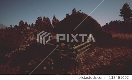 The cottage features a thatched roof and wooden fencing, surrounded by tall trees as dusk sets in, creating a serene countryside atmosphere filled with natural beauty. The cottage features a thatched roof and wooden fencing, surrounded by tall trees as dusk sets in, creating a serene countryside atmosphere filled with natural beauty. 132461002