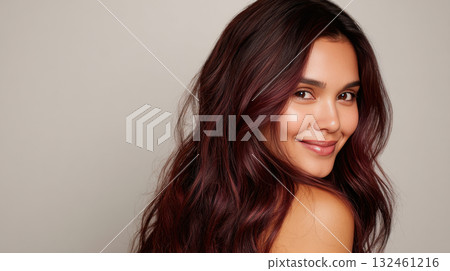 Young woman with long hair smiling 132461216